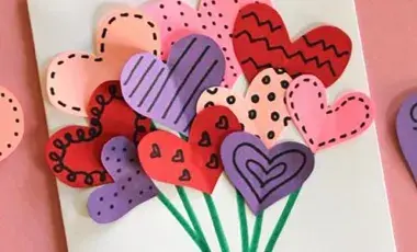 Handmade Valentine's Day card with a hand bouquet in the center