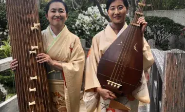 Two women holding a biwa and koto