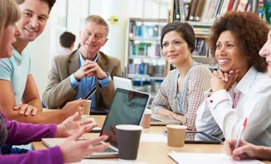 Group of adults having a learning discussion