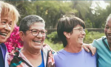 A group of older adults smiling