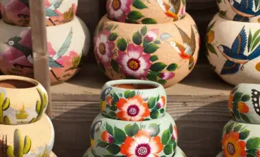 Painted terracotta pots with Southwestern motifs