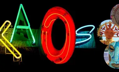 heritage masks and a neon sign that says KAOS