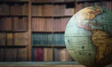 globe in front of book shelves