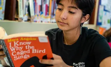 Teen girl reading.