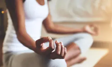person sitting cross legged meditating