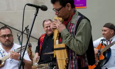 Four men playing instruments