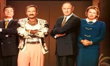 Three men and one woman standing