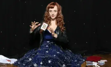 Magical Katrina performing a card trick