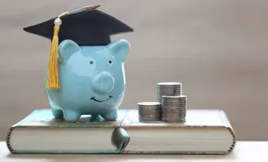 blue piggy bank with grad cap