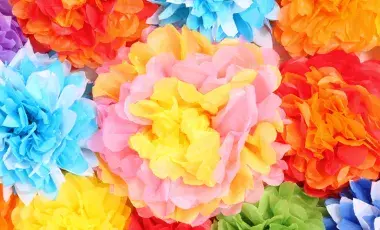 An assortment of brightly-colored paper tissue flowers.