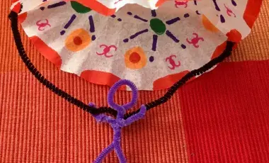 coffee filter parachute and a person made out of chenille sticks