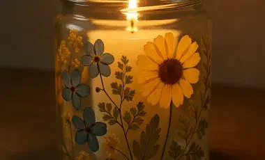 pressed flower on a jar with candle