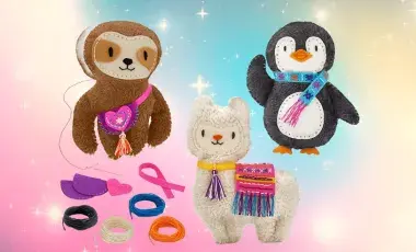 Sloth, lama, and penguin stuffed animal with sewing materials. 