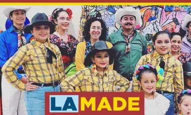 Various Mexican folk dancers of all ages dressed in traditional costume