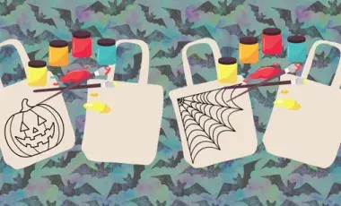 tote bags with Halloween designs and art supplies on a blue background with bats 