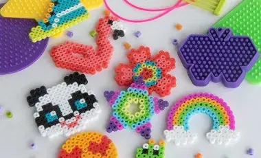 Image of various completed perler bead art and beads.