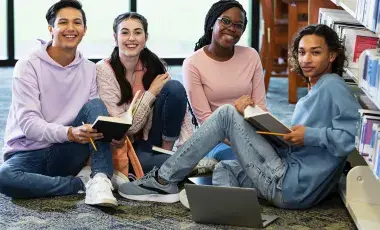 Teens studying in the library.