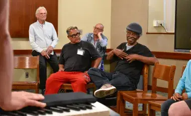 patrons participating in a neighborhood sing program 