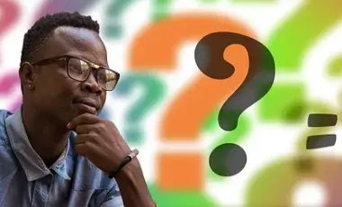 A picture of a Black man, thinking, with colorful question marks in the background. Image by Gerd Altmann from Pixabay