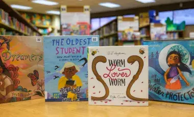 Four children's books displayed on a table