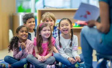 kids listening to a storytime in a library