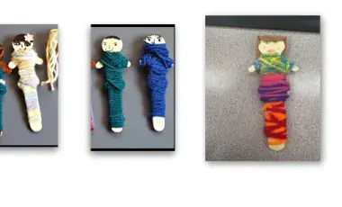 Handmade worry dolls with yarn and popsicle stick people 