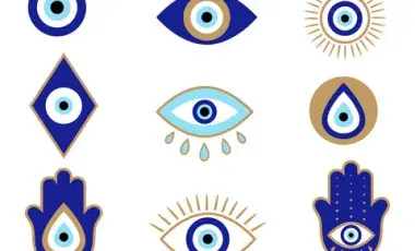Wallpaper with blue and gold evil eye symbols