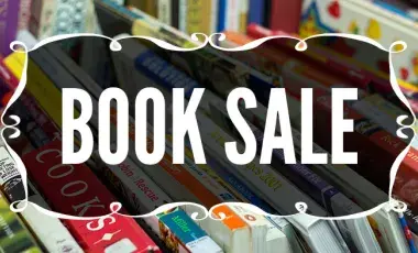 Words "Book Sale" on the background of books