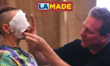 Brian Stock applying makeup to a teens face