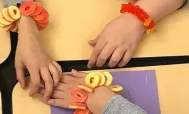 Wrists wearing candy jewelry bracelets