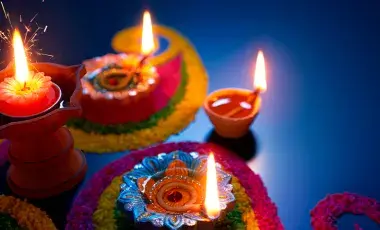 Celebrate Diwali with lighted candles in the colorful pots.
