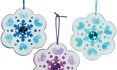 Colorful thumbprint snowflake ornaments.