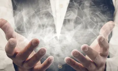 Image of hands holding smoke