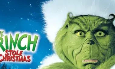 How the Grinch Stole Christmas film poster with the Grinch's face wearing a Santa's cap