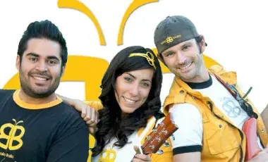 3 musicians holding guitars