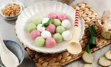 A bowl of multicolor dumplings