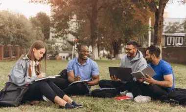 College Students Studying on Campus Lawn