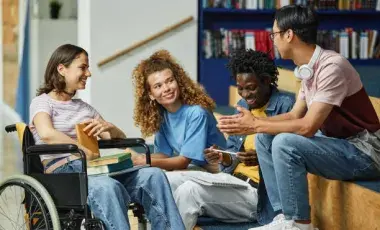 Diverse group of teens with one in a wheelchair.
