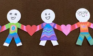 Craft of three people holding heart hands