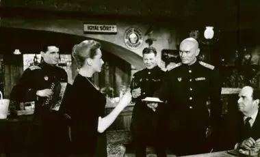 four men and one woman attending an event 