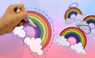 Hand coloring a rainbow on plastic which will become a shrinky dink when baked..