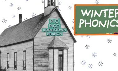 Black and white school house with snowflakes. 