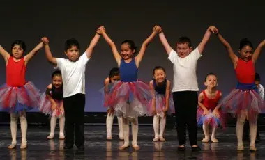 image of kids on a stage