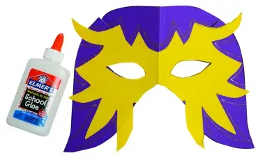 Lucha Libre mask made from purple and yellow construction paper shown with a bottle of Elmer's glue