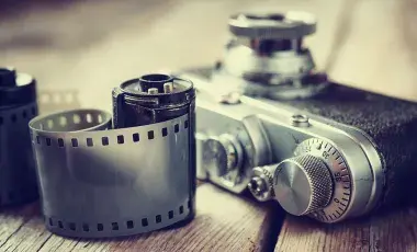A 35mm film camera and two rolls of 35mm film.