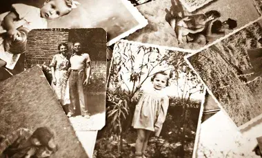 a pile of old black and white photographs