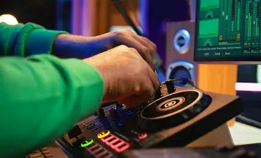 hands at a turntable ready to dj