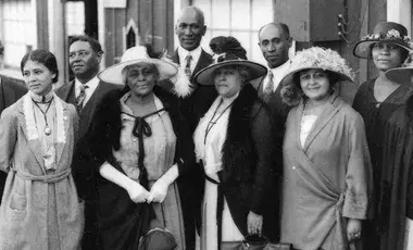 Historic photo of several African American people dressed in formal attire