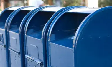 Four blue mailboxes