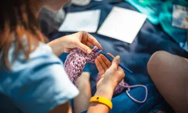 image of a woman crocheting